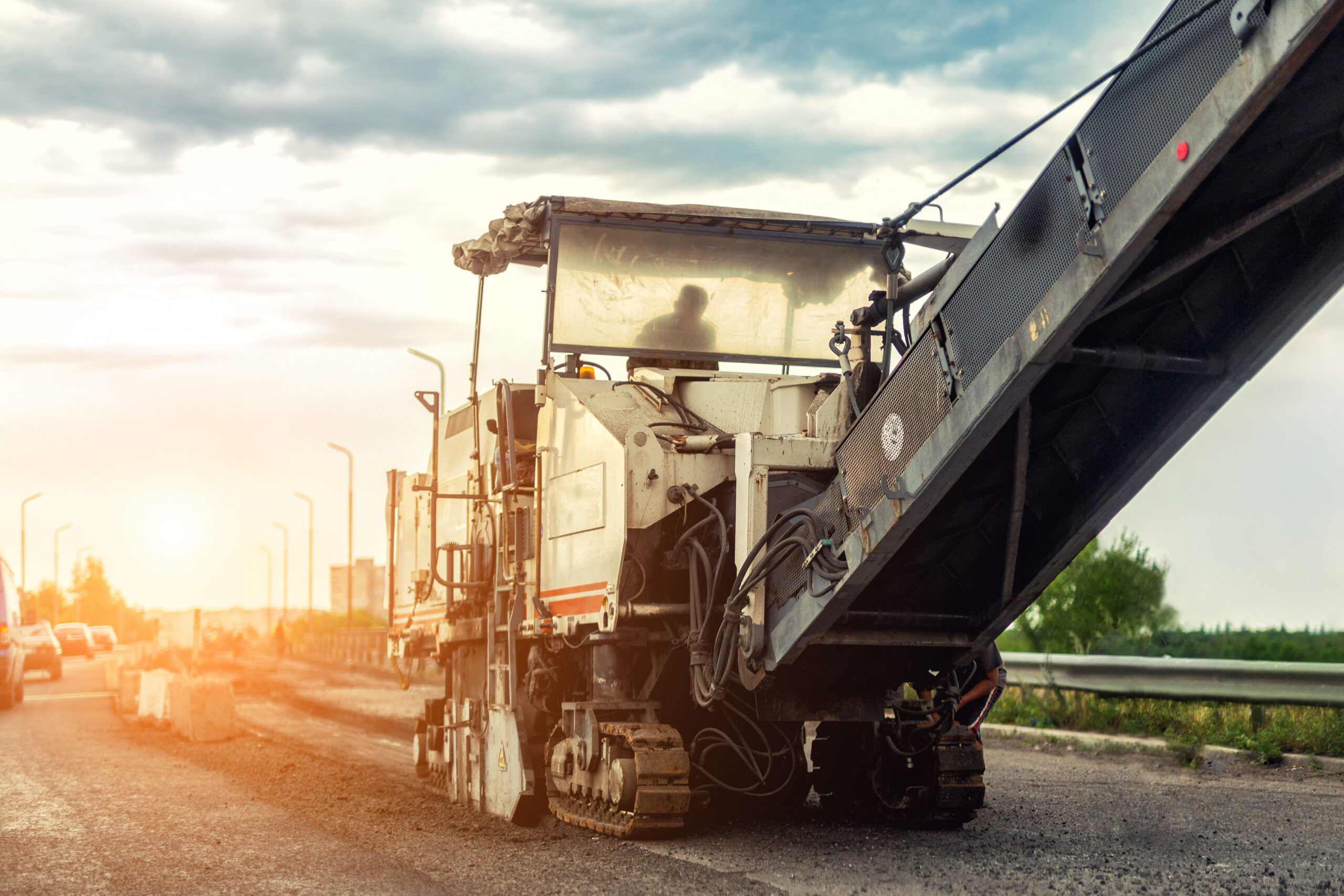 Asphalt milling machine preparing a Houston parking lot surface for an overlay